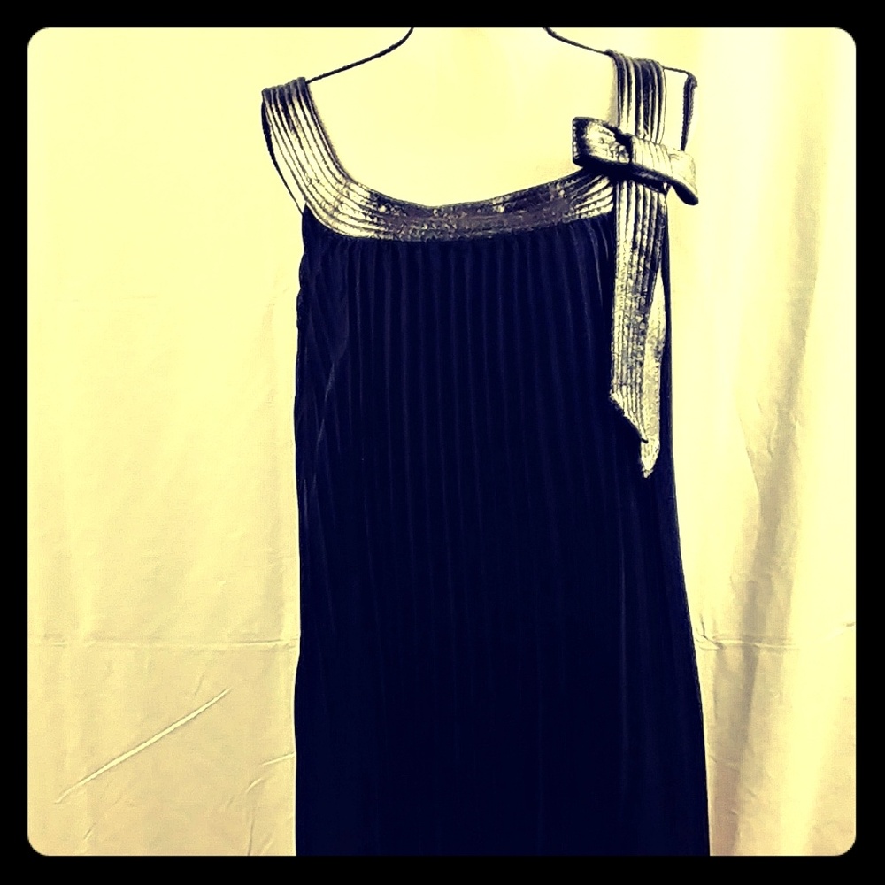 Pleated black dress with silver bow detail
